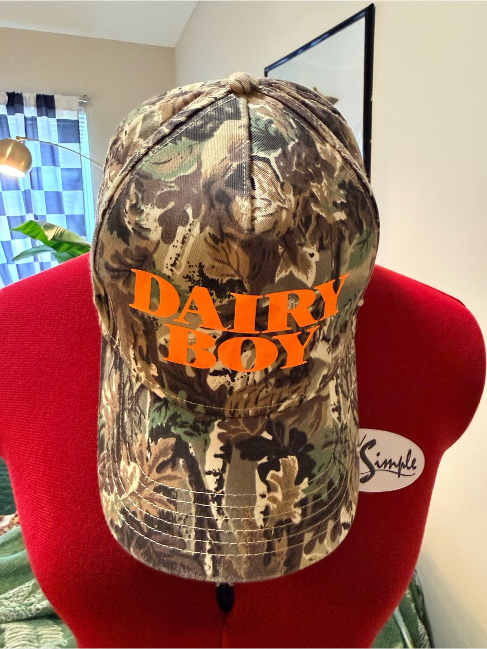 Dairy Boy Camo Hat with Orange Logo